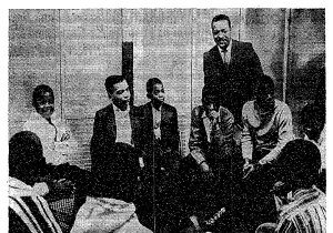 Rev. Milton Galamison in a &quot;600&quot; school classroom with a group of black teenagers