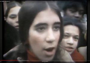 Still image from a news report showing a young Puerto Rican woman being interviewed