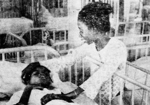 Newspaper clipping that includes a photo of Willie Mae Goodman, who is a Black woman, visiting her 18-year old daughter Marguerite in the Gouverneur State School.