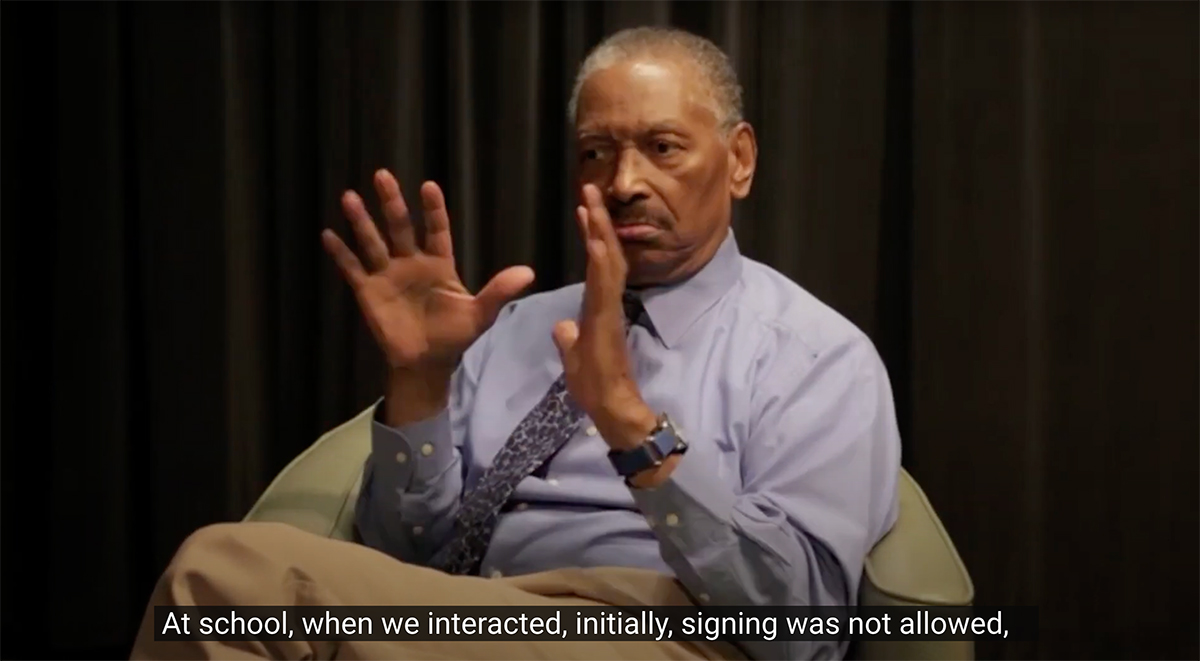 Still image from video interview with Thomas Samuels, an older Black man, who signs